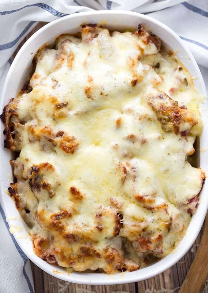 Bacon Ranch Potatoes - Soft, tender potatoes smothered in ranch sauce and loaded up with crispy bacon, caramelized onions and melted Swiss cheese. This comfort food recipe is a keeper!