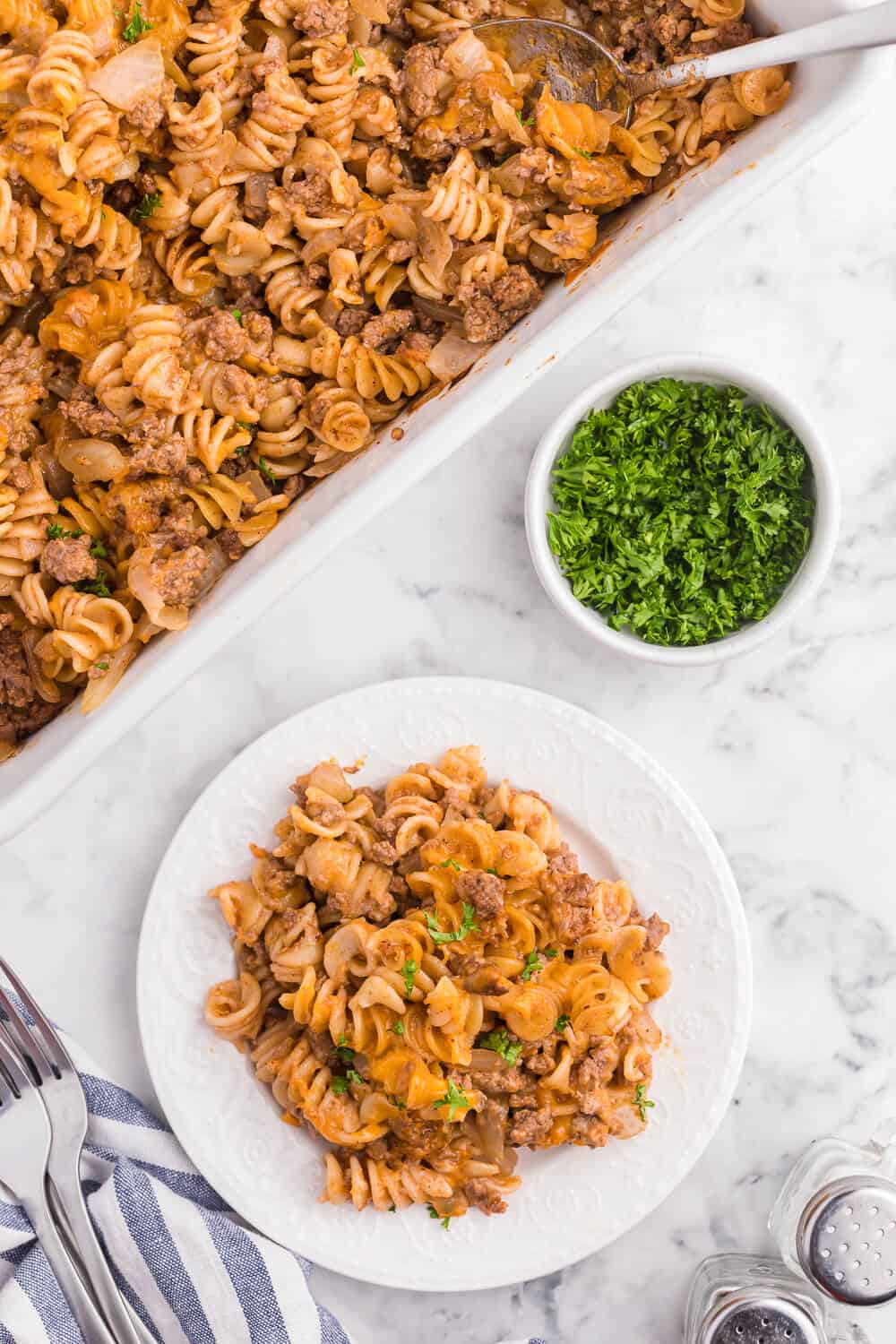 Cheesy BBQ Beef Casserole - Ground beef, cheese and tangy BBQ sauce create a quick, easy and cost-effective family meal that everyone is sure to enjoy. This dish is a great make-ahead meal, and makes a great lunch the next day!