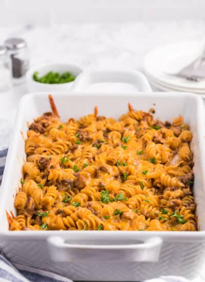 Cheesy BBQ Beef Casserole - Ground beef, cheese and tangy BBQ sauce create a quick, easy and cost-effective family meal that everyone is sure to enjoy. This dish is a great make-ahead meal, and makes a great lunch the next day!