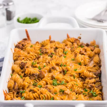 Cheesy BBQ Beef Casserole - Ground beef, cheese and tangy BBQ sauce create a quick, easy and cost-effective family meal that everyone is sure to enjoy. This dish is a great make-ahead meal, and makes a great lunch the next day!