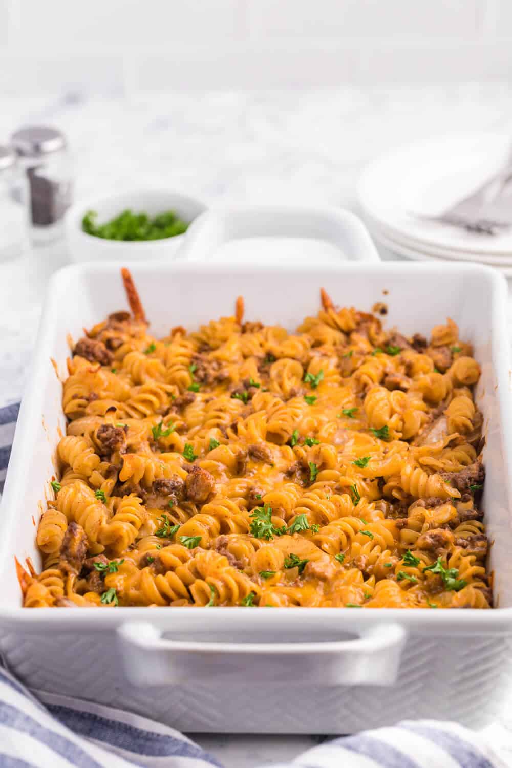 Cheesy BBQ Beef Casserole - Ground beef, cheese and tangy BBQ sauce create a quick, easy and cost-effective family meal that everyone is sure to enjoy. This dish is a great make-ahead meal, and makes a great lunch the next day!