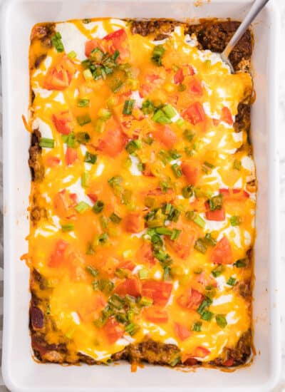 Taco Casserole - A fun twist on Taco Tuesday! This easy casserole has all the ingredients we love about tacos, baked together in one convenient baking dish - quick to make and quick to clean up!