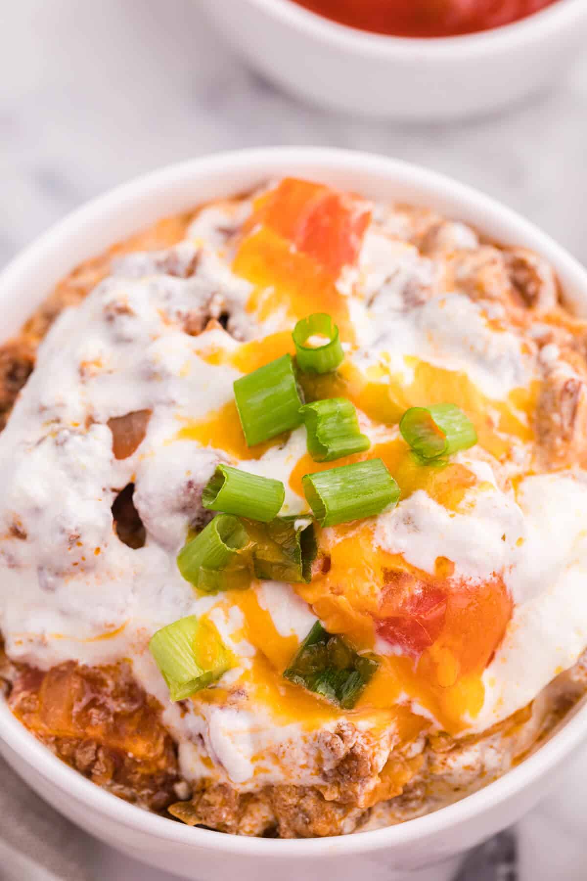 A close up of a bowl of taco casserole.