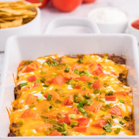 Taco casserole in a white casserole dish.