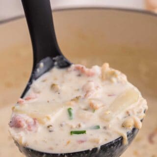 A ladle of new england clam chowder.