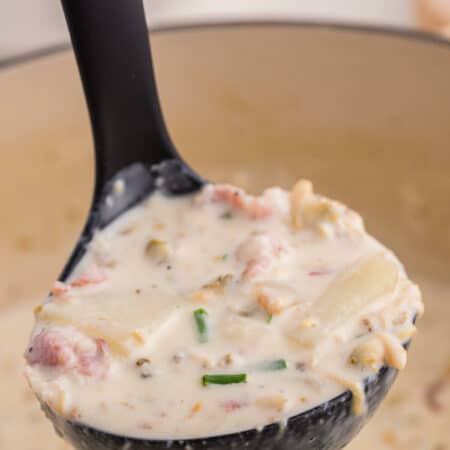 A ladle of new england clam chowder.