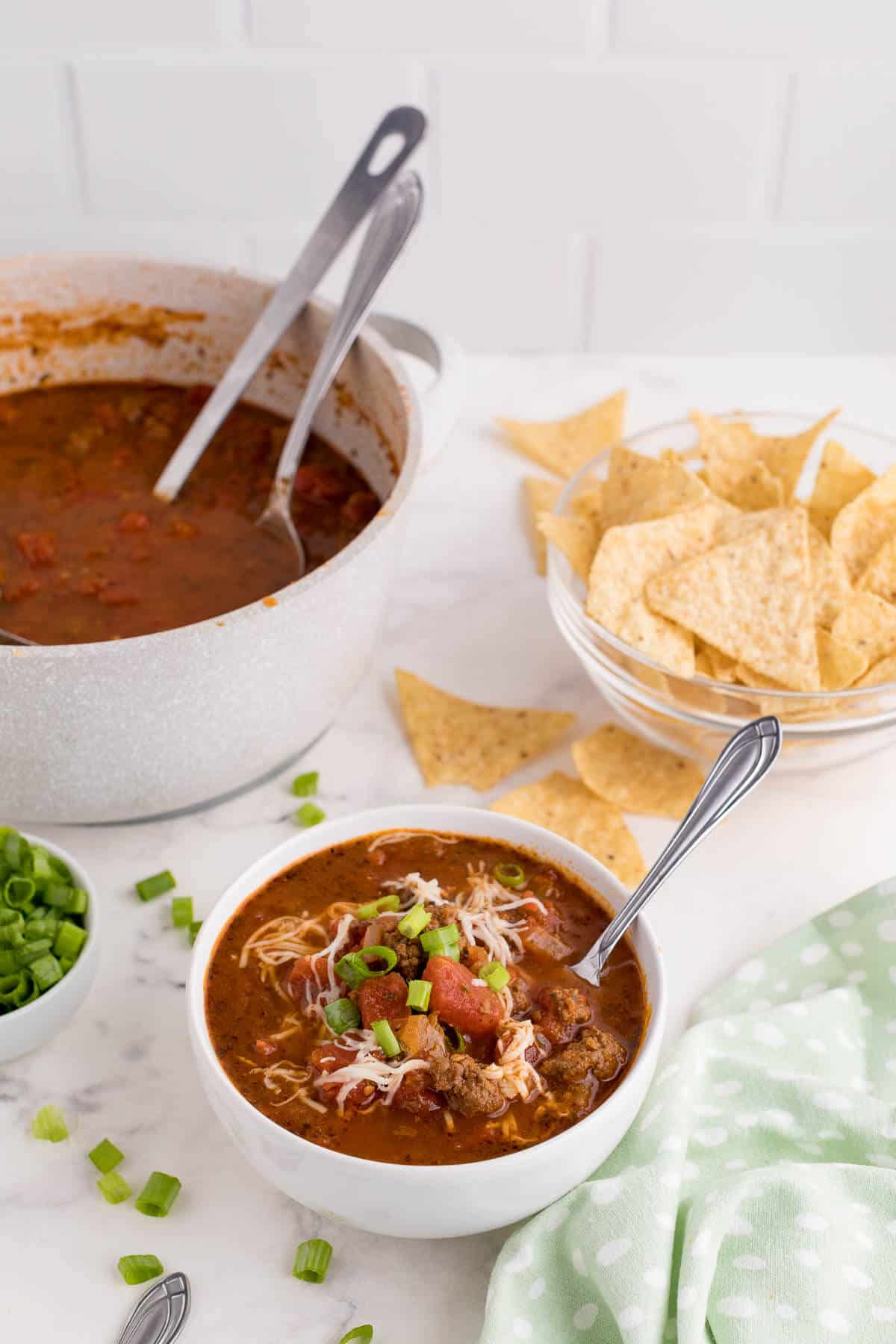 Taco soup in a bowl with a spoon.