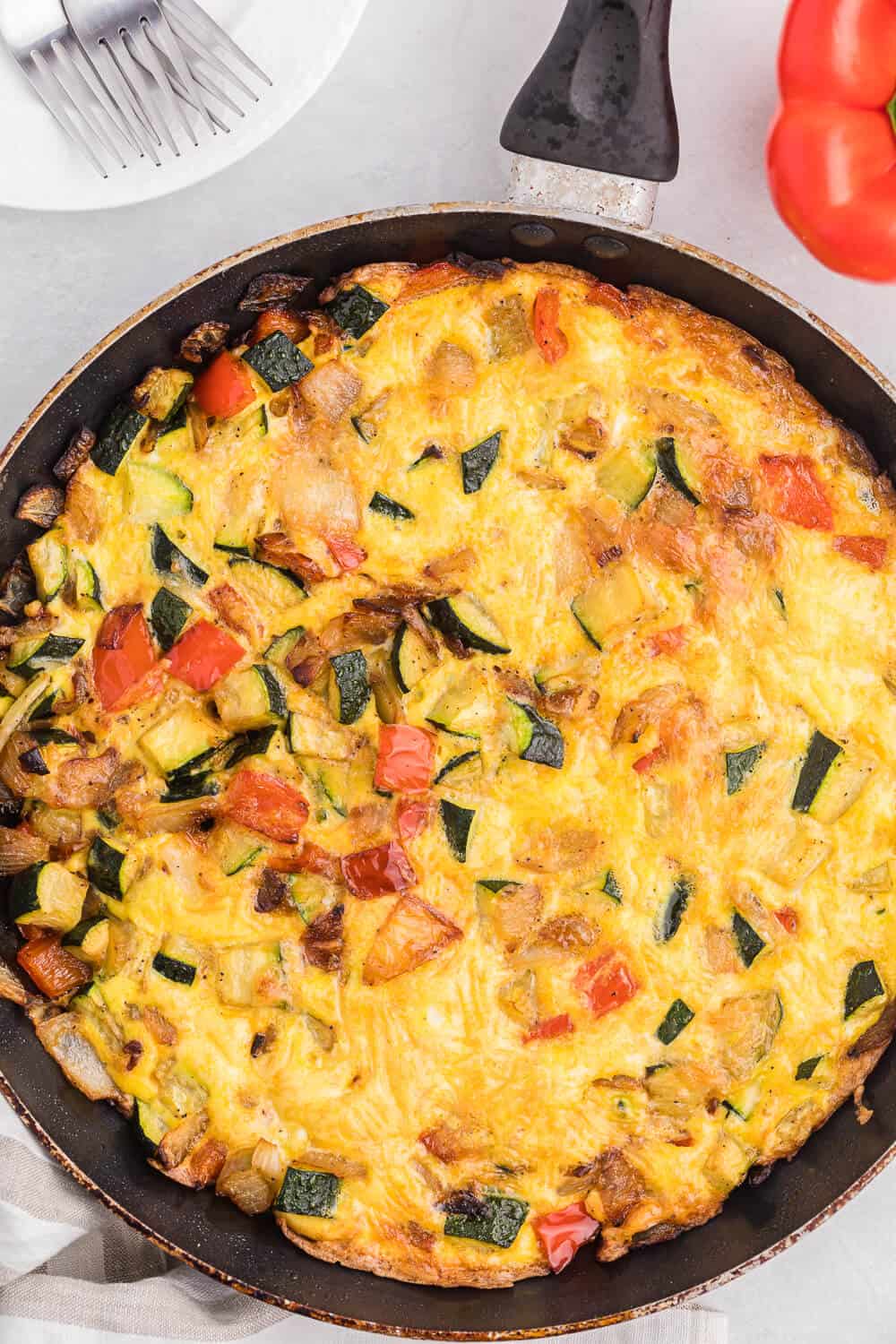 Caramelized Onion, Red Pepper & Zucchini Frittata - Loaded with red pepper and zucchini, this veggie-packed dish is healthy and filling - and low carb too!