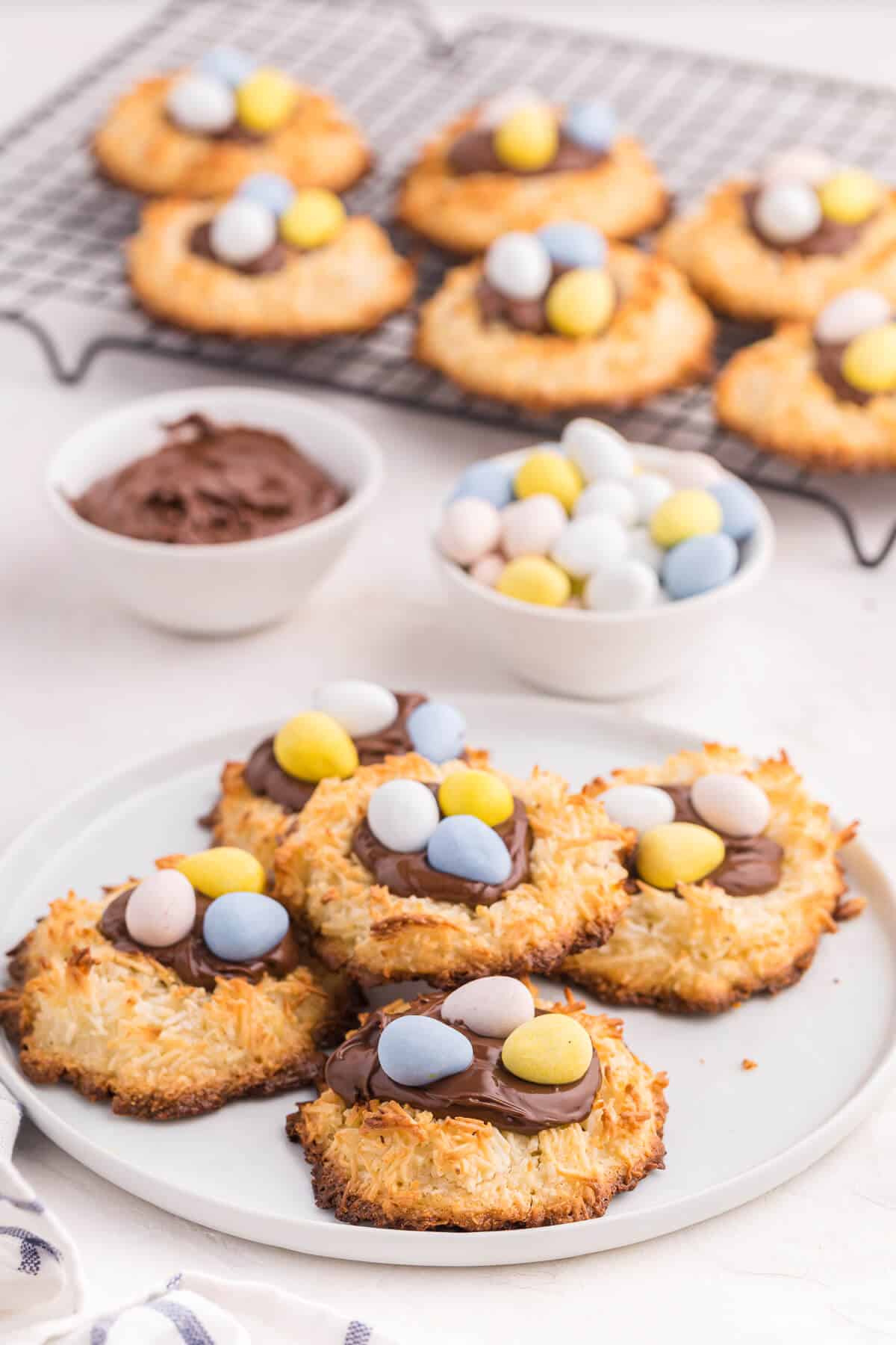 Coconut macaroon nutella cookie nests on a plate.