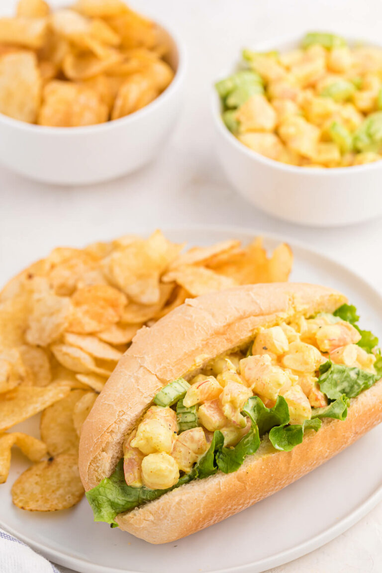 Curried Shrimp Rolls on a plate with potato chips.