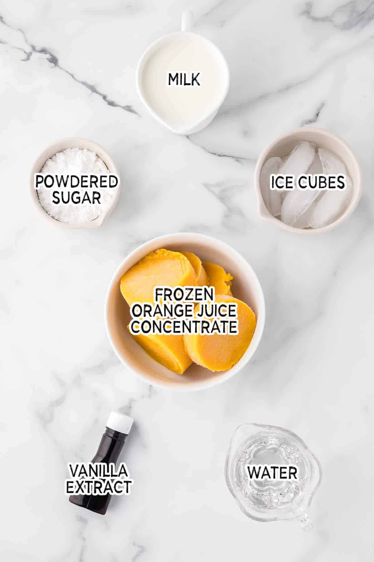 Ingredients on a white marble counter.