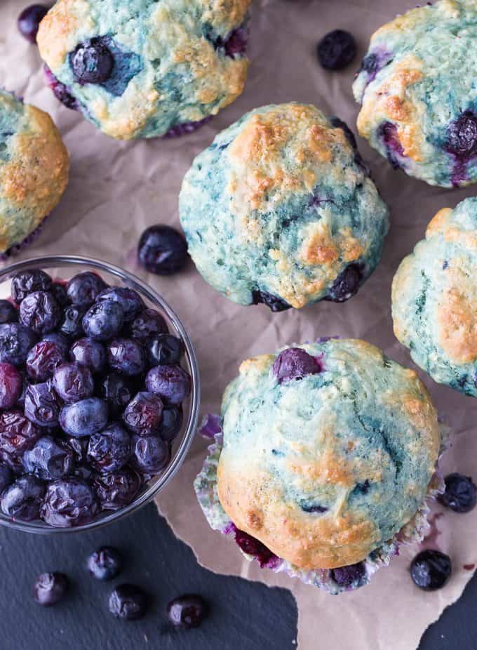Blueberry Yogurt Muffins - These blueberry packed muffins are a perfect make-ahead for snacks and breakfast on-the-go. Using Greek yogurt in the recipe helps amp up the protein!