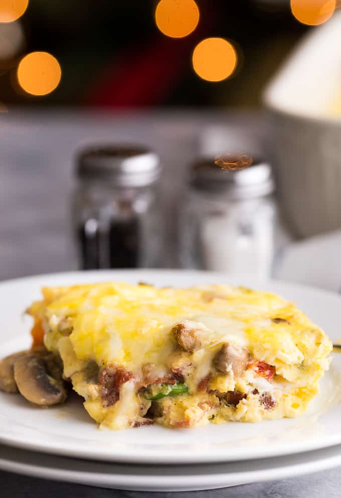 Crustless Bacon and Cheese Quiche - Rich, creamy eggs with bacon and cheese are a fantastic, lower carb option for brunch or dinner. Served with fruit or mixed greens, this is delicious and satisfying, no matter what time of day you make it! 
