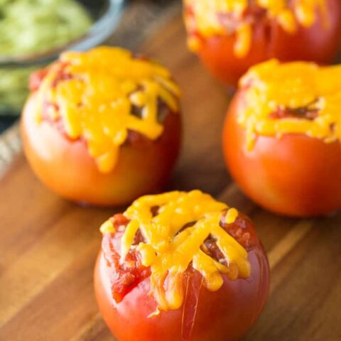 Guacamole Tomato Boats - Stuffed tomatoes with a Mexican flair! Serve them at a party or for a healthy snack.