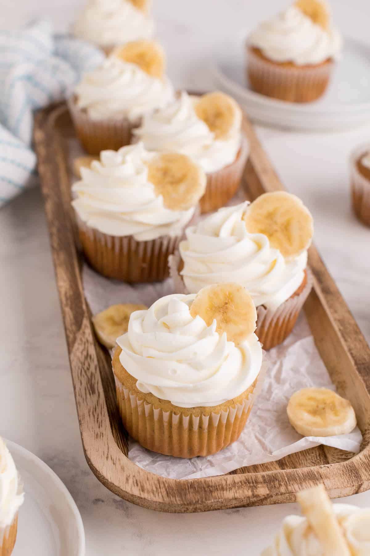Banana cupcakes on a platter.
