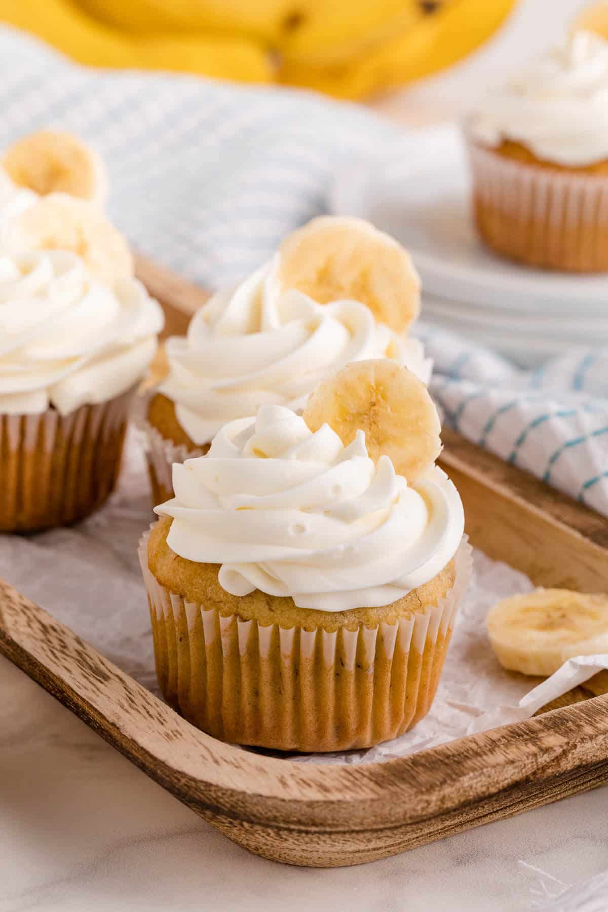 Banana cupcakes on a platter.