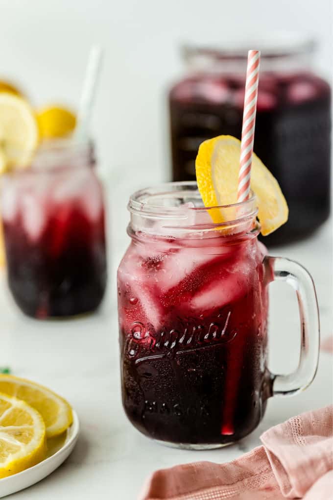 Sparkling Grape Lemonade - With bubbly lemon lime soda, frozen grape punch and lemonade, this drink is so easy to make when entertaining, or when you want to treat the kids to a special summery drink.