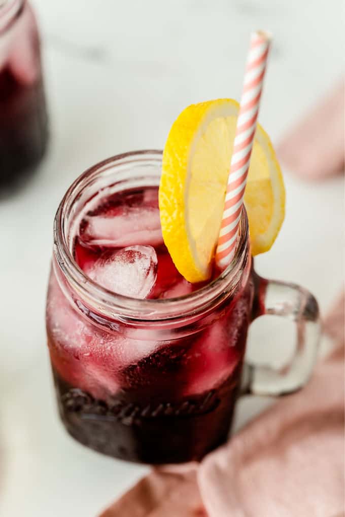 Sparkling Grape Lemonade - With bubbly lemon lime soda, frozen grape punch and lemonade, this drink is so easy to make when entertaining, or when you want to treat the kids to a special summery drink.