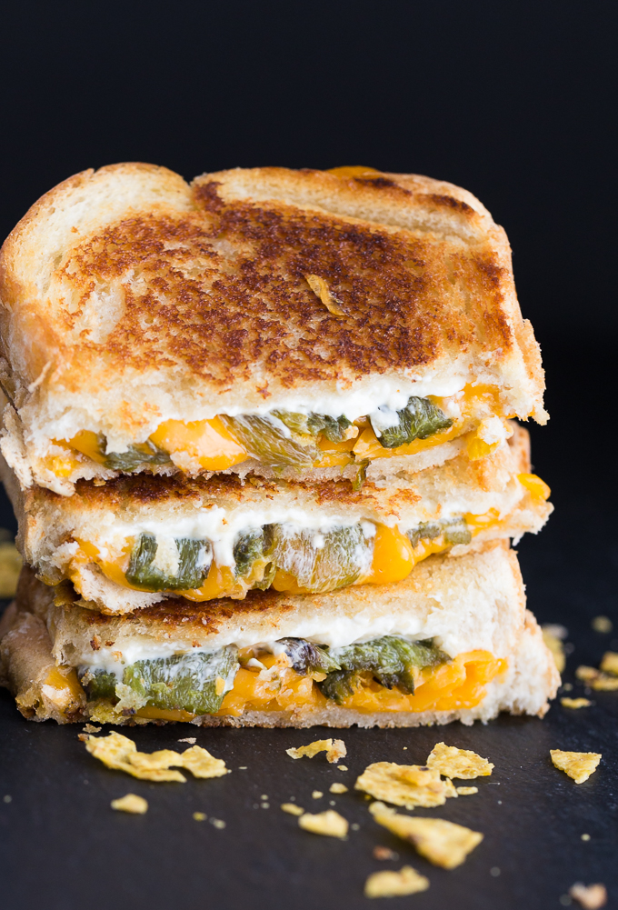 Jalapeno Popper Grilled Cheese Sandwich - The BEST grilled cheese recipe! Stuff your favorite zesty appetizer between crunchy toasted bread and smothered in more cheese. 