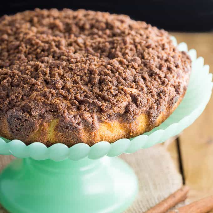 Streusel Coffee Cake - Another classic cake - for good reason! The crumbly cinnamon topping and the moist cake are the perfect pairing with a hot cup of coffee! This is a great make-ahead cake to have in the freezer for unexpected guests.