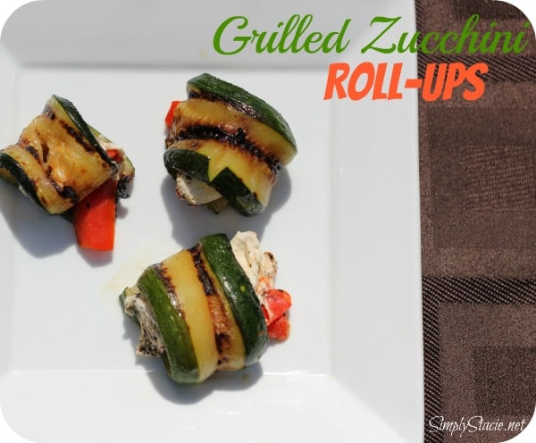 Grilled Zucchini Roll-Ups - A simple, but savory summer appetizer. This easy recipe wraps grilled zucchini strips around herbed goat cheese and grilled red peppers with a finish of extra olive oil and balsamic vinegar. Mmm!