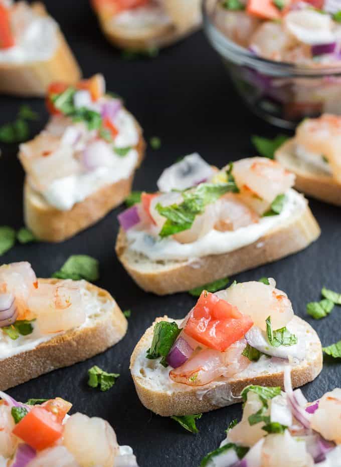 Zesty Shrimp Flatbred - Tantalize your tastebuds with this appetizer. Tzatziki, mint and jalapenos collide to kick the zing up on this shrimp recipe. 