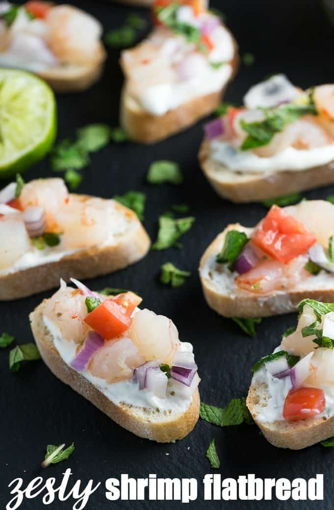 Zesty Shrimp Flatbred - Tantalize your tastebuds with this appetizer. Tzatziki, mint and jalapenos collide to kick the zing up on this shrimp recipe. 