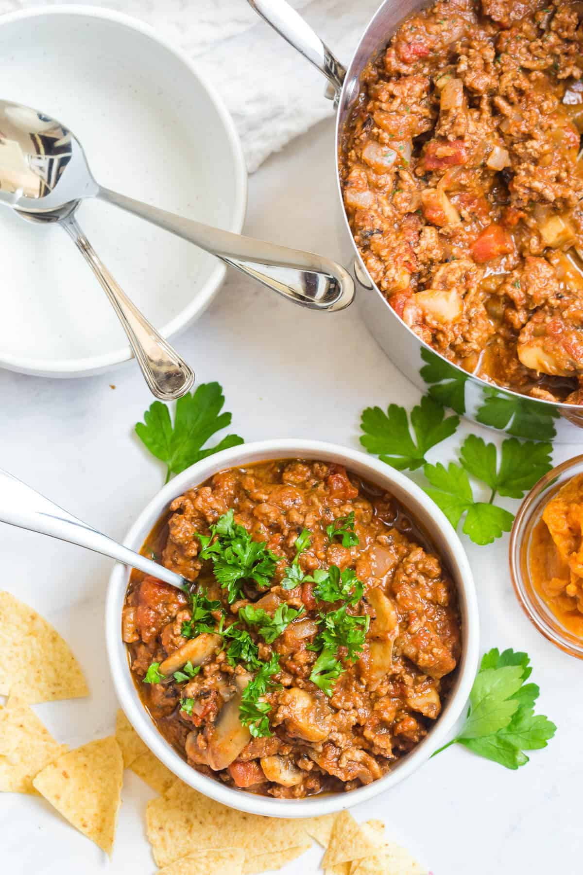 Pumpkin chili in a bowl with a spoon.