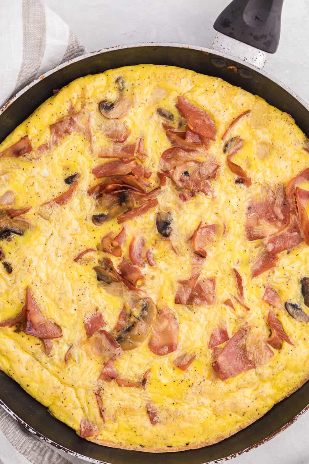 Turkey Bacon Frittata - Cut a few calories on this amazing brunch dish! Swap the pork for turkey in this delicious egg dish that's perfect for breakfast or dinner.