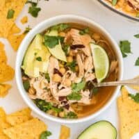 chipotle chicken soup in a soup bowl with a spoon