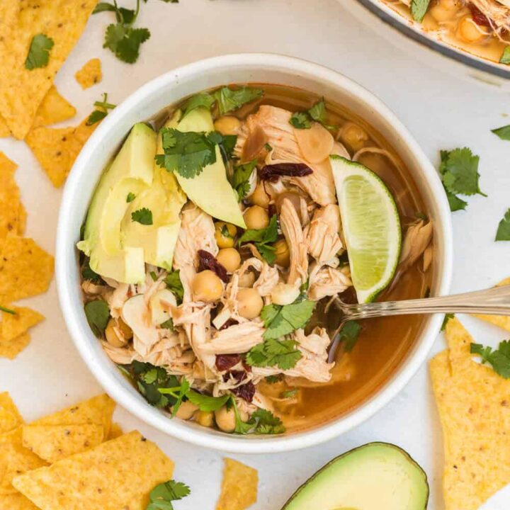 chipotle chicken soup in a soup bowl with a spoon
