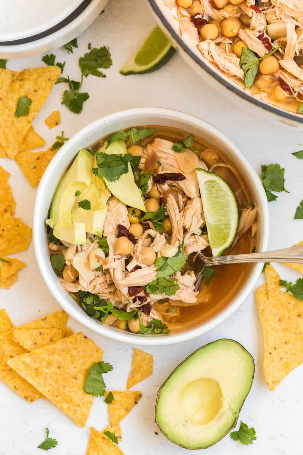 chipotle chicken soup in a soup bowl with a spoon