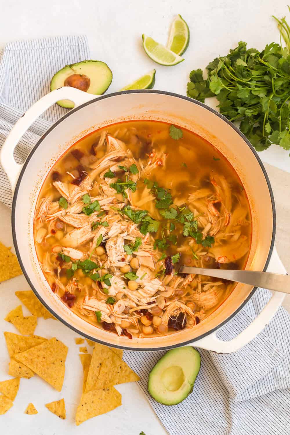 chipotle chicken soup in a soup pot with a ladle