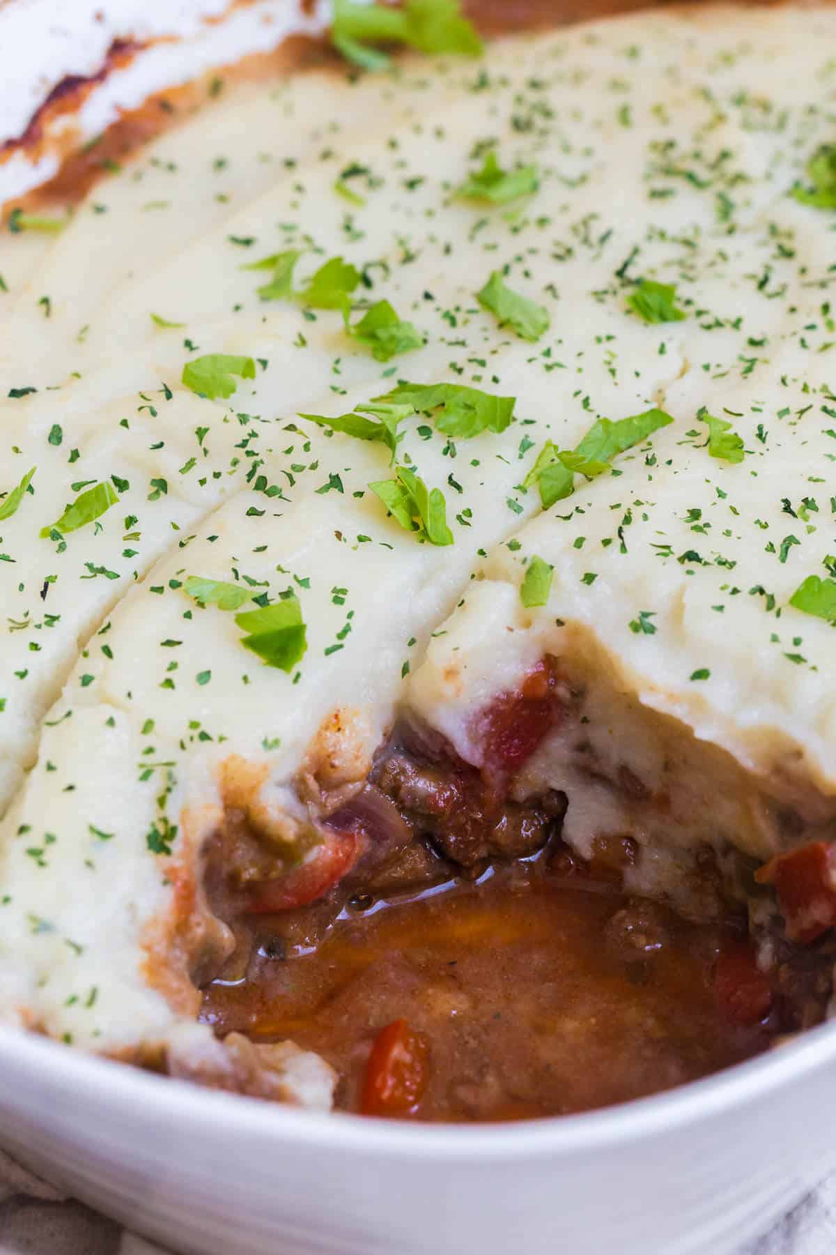 Beef Picadillo Shepherd's Pie with a piece cut out of it.