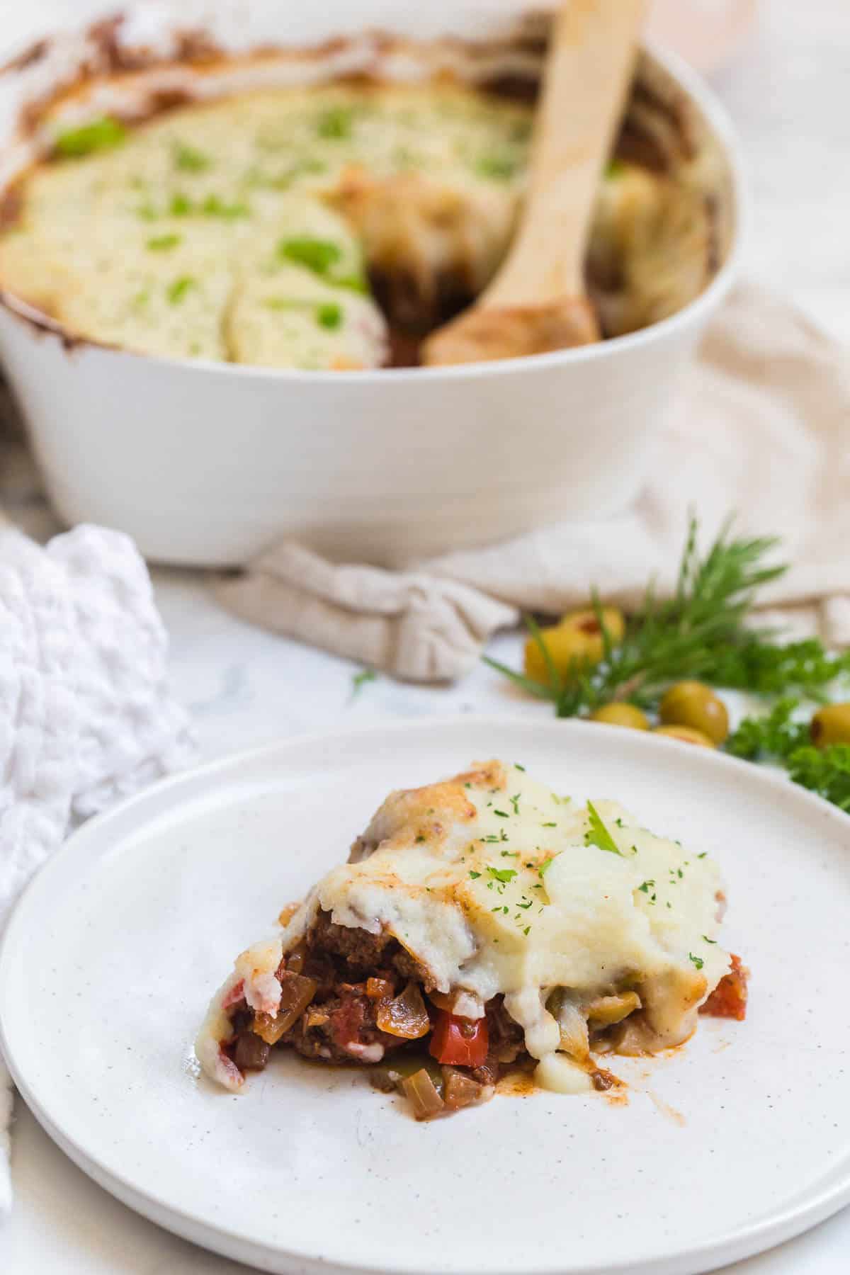 A piece of Beef Picadillo Shepherd's Pie On a plate.