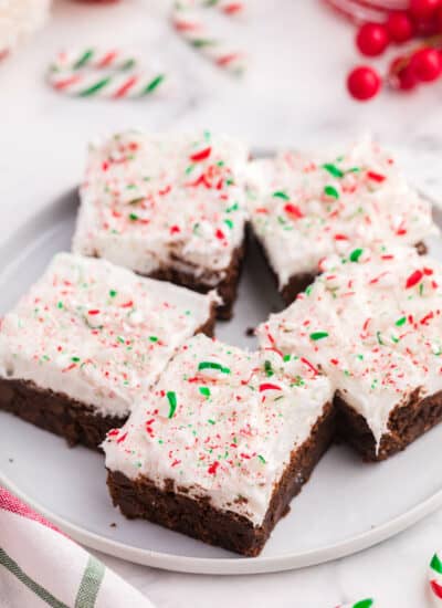 candy cane brownies on a white plate