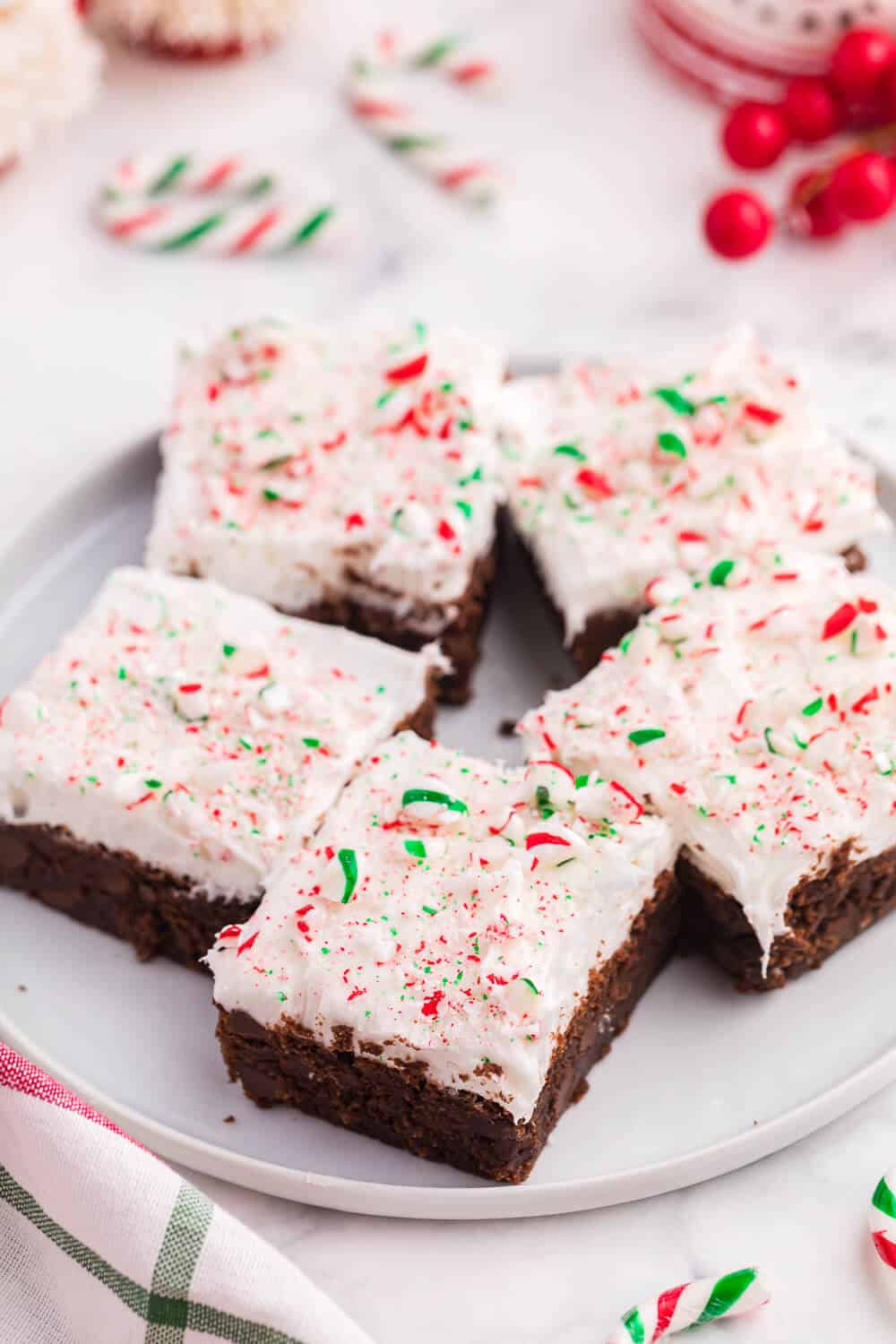 candy cane brownies on a white plate