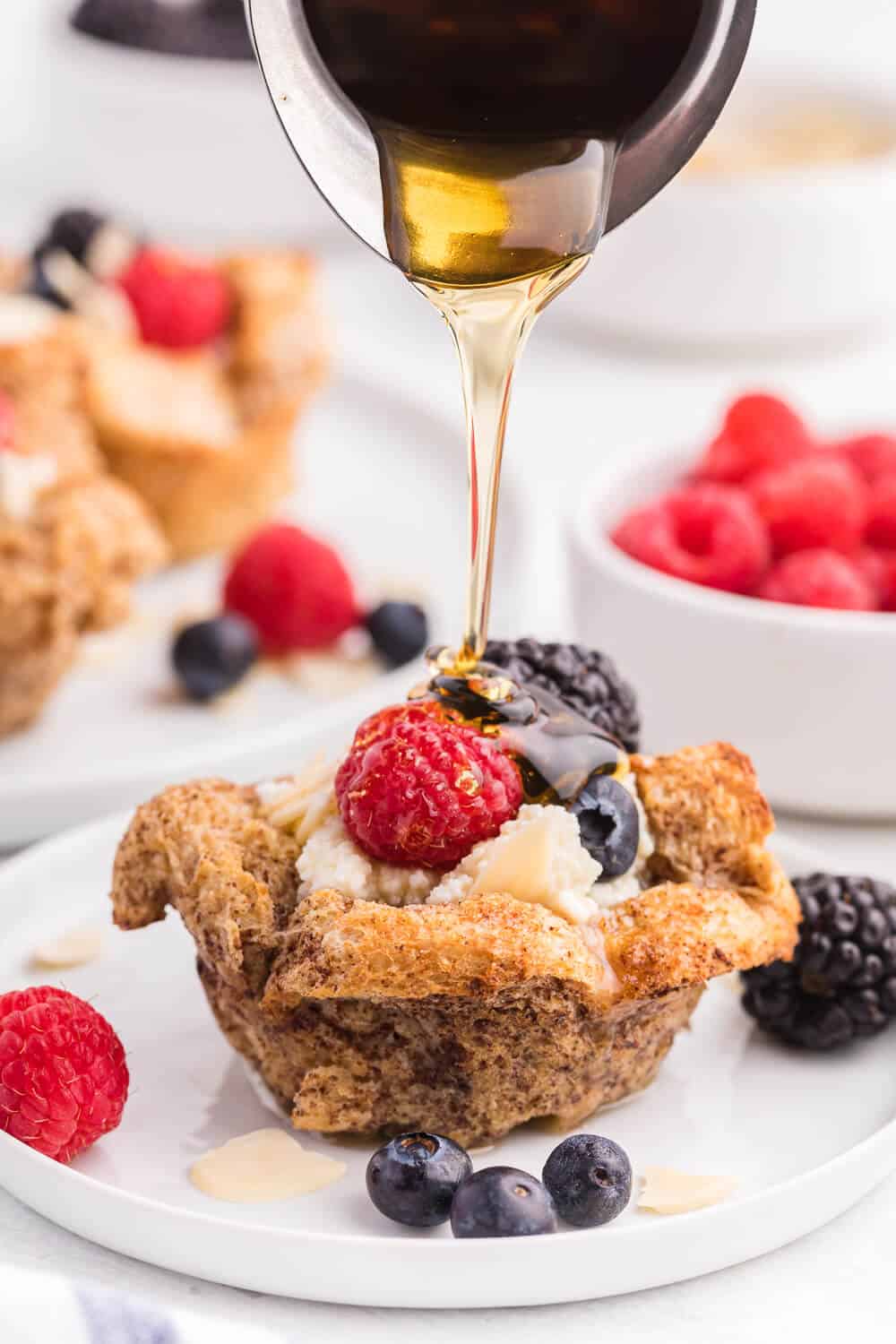 French Toast Cups - This easy breakfast recipe is the perfect sweet start to your day. Creamy ricotta with fresh berries and a drizzle of honey or maple syrup are a delicious breakfast treat.