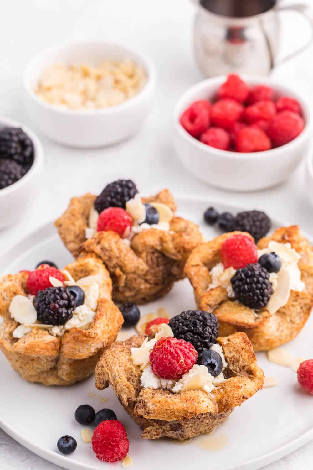 French Toast Cups - This easy breakfast recipe is the perfect sweet start to your day. Creamy ricotta with fresh berries and a drizzle of honey or maple syrup are a delicious breakfast treat.