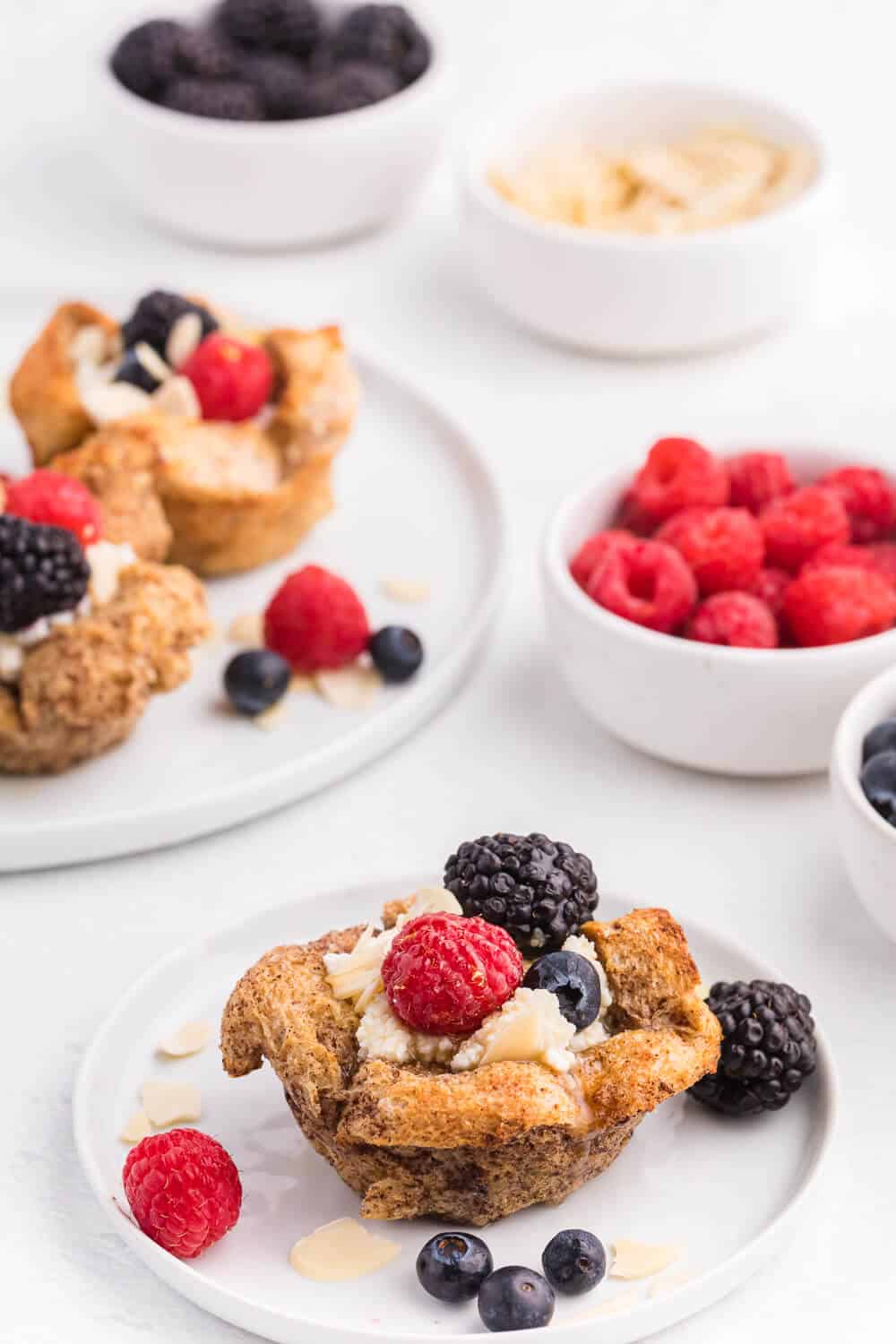 French Toast Cups - This easy breakfast recipe is the perfect sweet start to your day. Creamy ricotta with fresh berries and a drizzle of honey or maple syrup are a delicious breakfast treat.