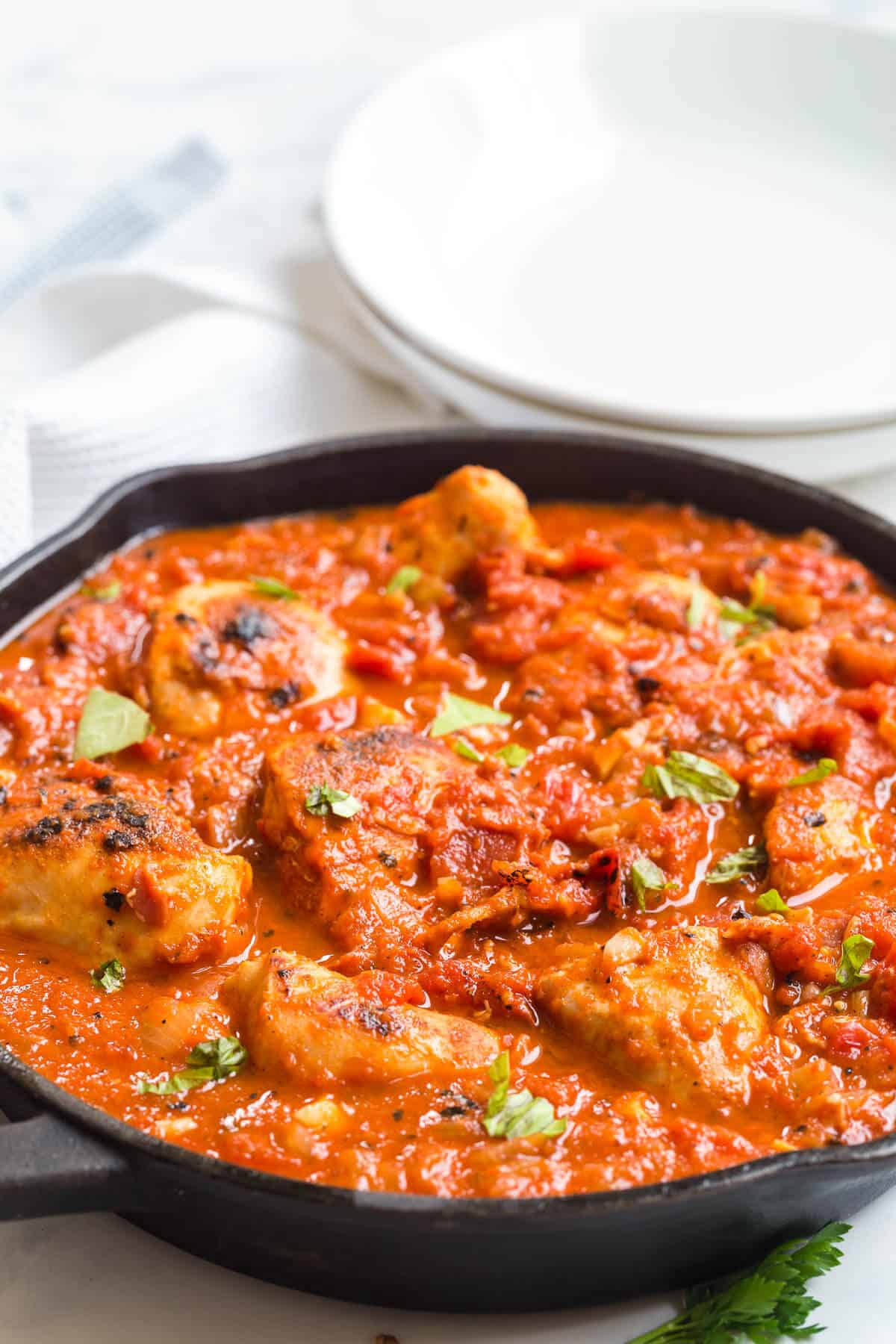 Roasted red pepper chicken in a cast iron skillet.