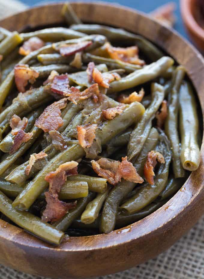 Southern Style Green Beans - The easiest 5-ingredient side dish! Salty bacon is the perfect companion for crisp green beans with a little onion and chicken broth. Yum!