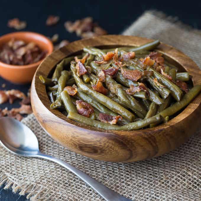 Southern Style Green Beans - The easiest 5-ingredient side dish! Salty bacon is the perfect companion for crisp green beans with a little onion and chicken broth. Yum!