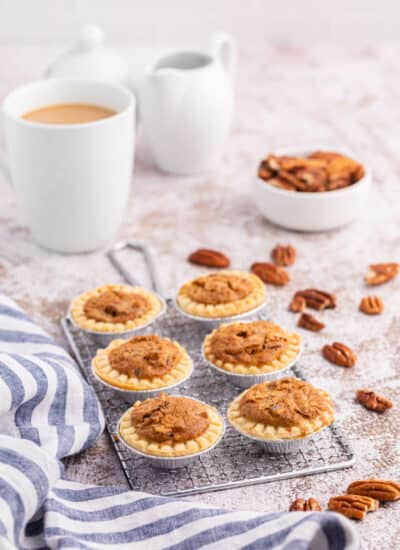 Pecan butter tarts on a wire rack.