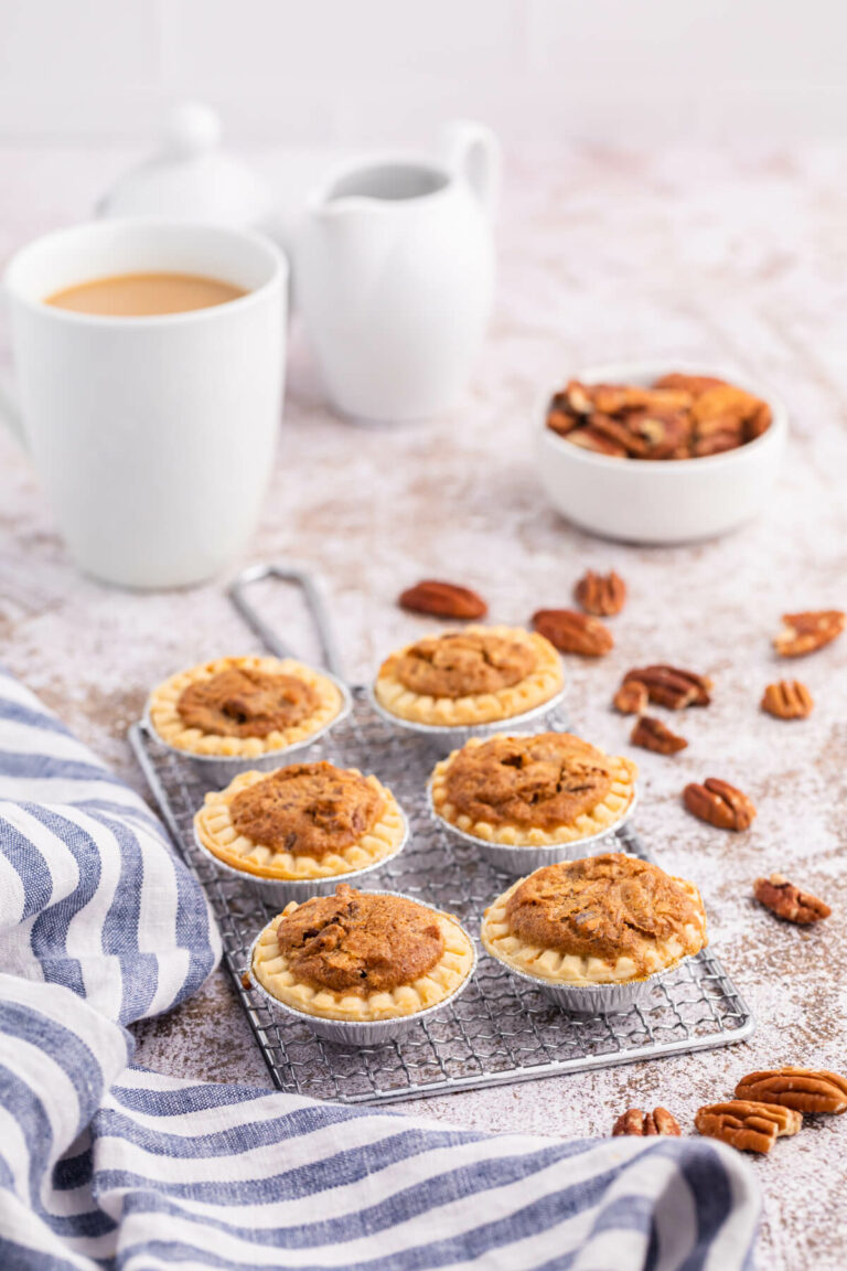 Pecan butter tarts on a wire rack.