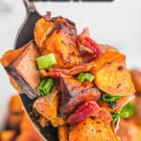 Sweet potato home fries on a serving spoon.