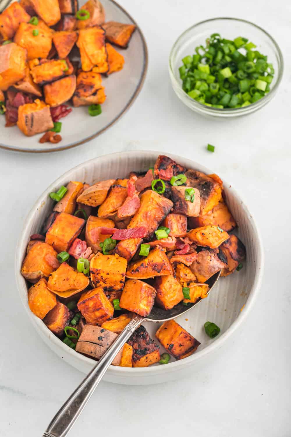 Sweet potato home fries in a pan.