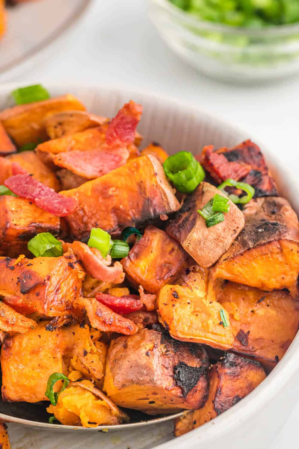 Sweet potato home fries in a pan.