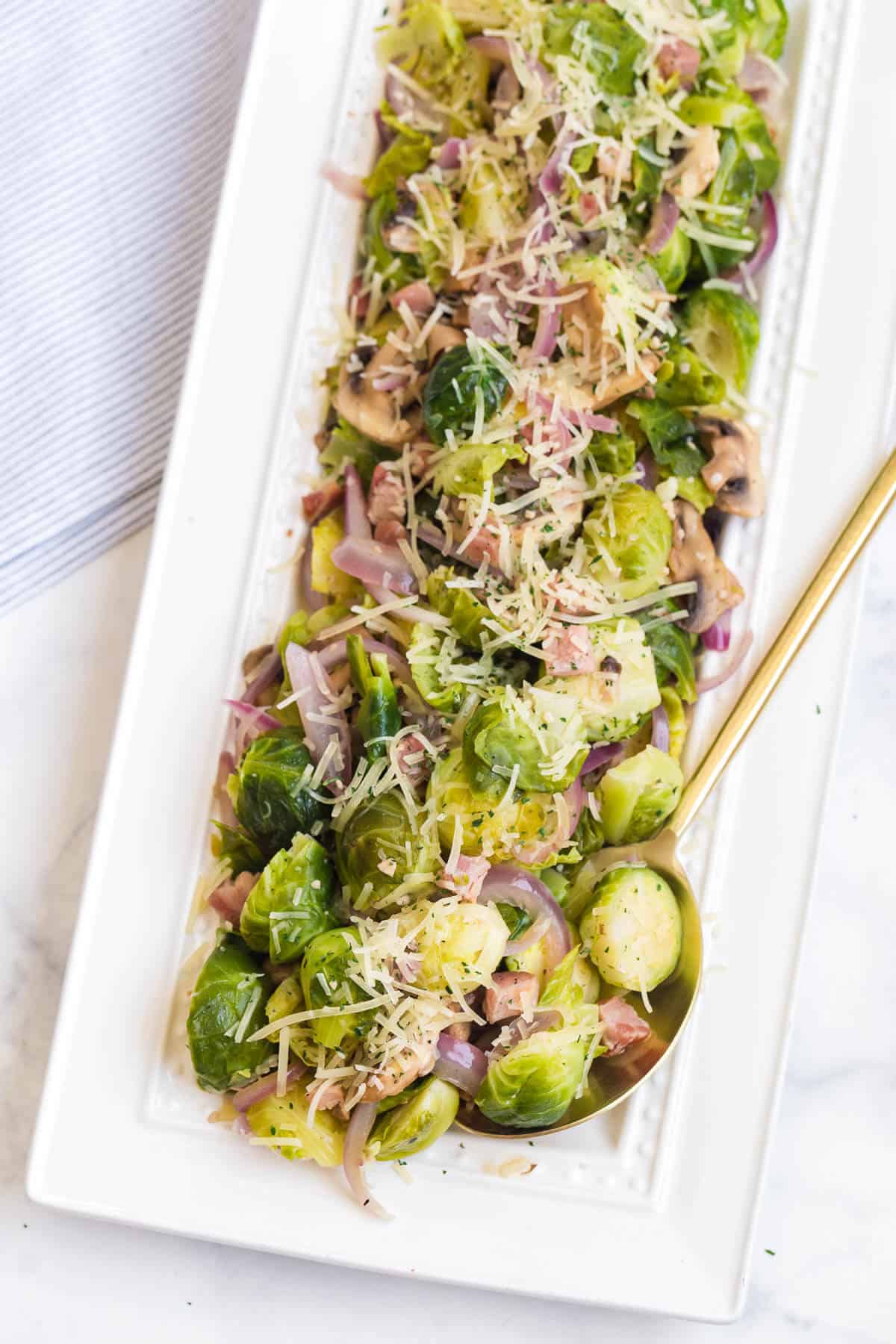 A platter of brussel sprouts with lemon and pancetta.