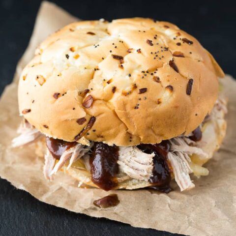 Slow Cooker Pulled Pork - Slow Cooker Pulled Pork - Tender and succulent pork shoulder roast piled high on my favorite sweet rolls. Yum!
